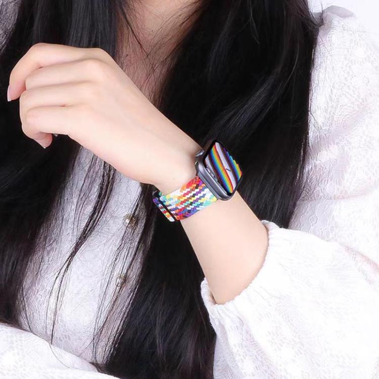 Multicolor braided nylon watch band worn on a wrist.