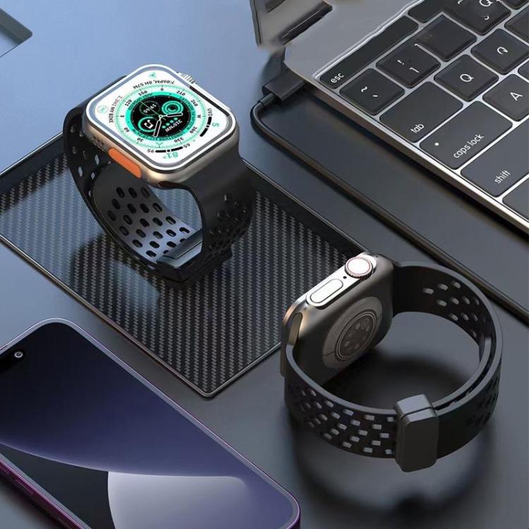 Black perforated silicone watch band with magnetic clasp fitted to a smartwatch