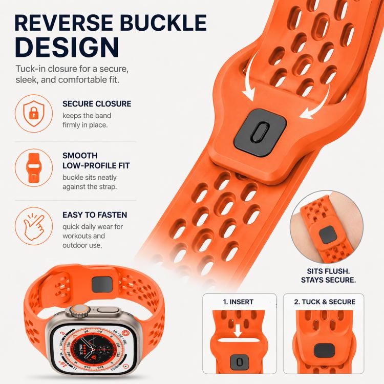 Close-up of an orange perforated silicone watch band with a reverse buckle clasp.