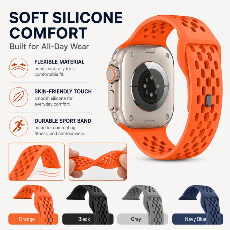 Orange perforated silicone watch band on a watch, with flexible strap and buckle details.