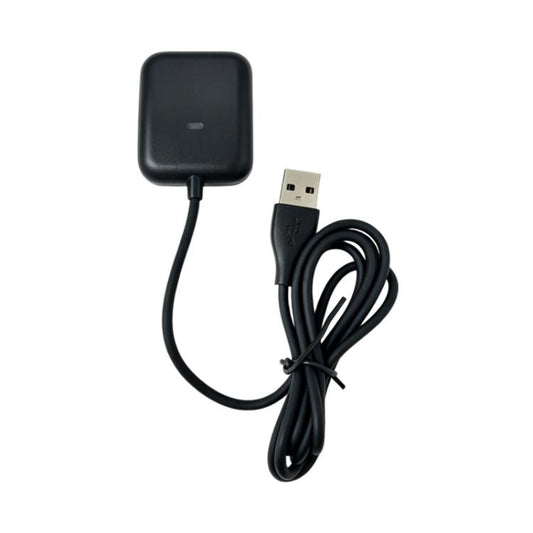 Black WHOOP 5.0 watch charger with USB-A plug and coiled cable, front view