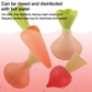 Vegetable toy pieces with water droplets and green tops, orange carrots and red radishes