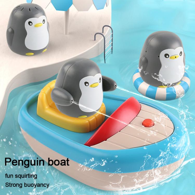 Children's bath toy penguin boat with two penguins and a red water sprayer on the dock