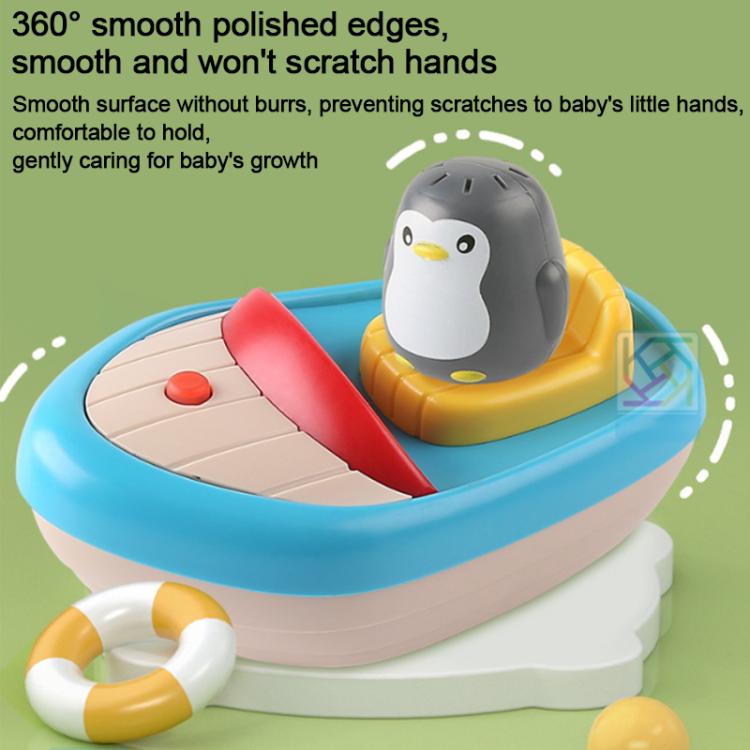 Round-edged penguin boat bath toy with blue base, red sprayer, and grey penguin figure