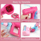 Pink vacuum toy with clear dust lid, flexible nozzle, and sound-effect start button