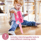 Pink pretend play vacuum cleaner toy held by a child, with simulated suction head