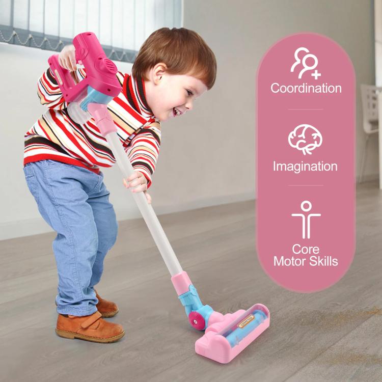 Pink toy vacuum cleaner with flexible handle and base, used by a child
