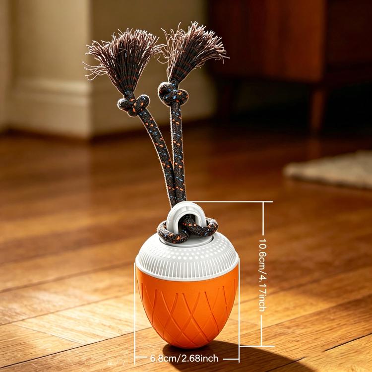 Orange automatic pet toy ball with rope handles and spiky brush ends