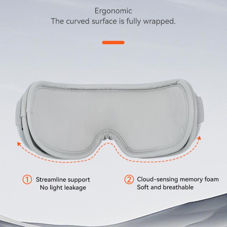 Gray ergonomically contoured eye massager with curved padded underside