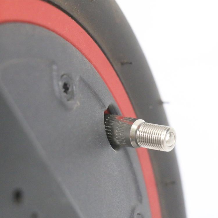 Air valve stem with silver threads fitted to scooter wheel rim