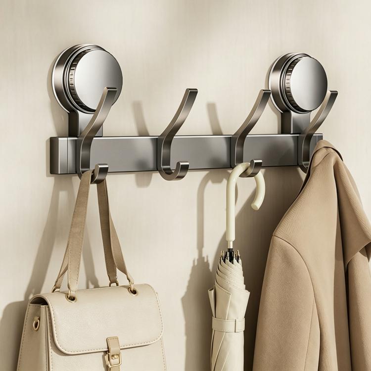 No-drill suction cup hook rack with brushed metal bar, curved hooks, and hanging handbags