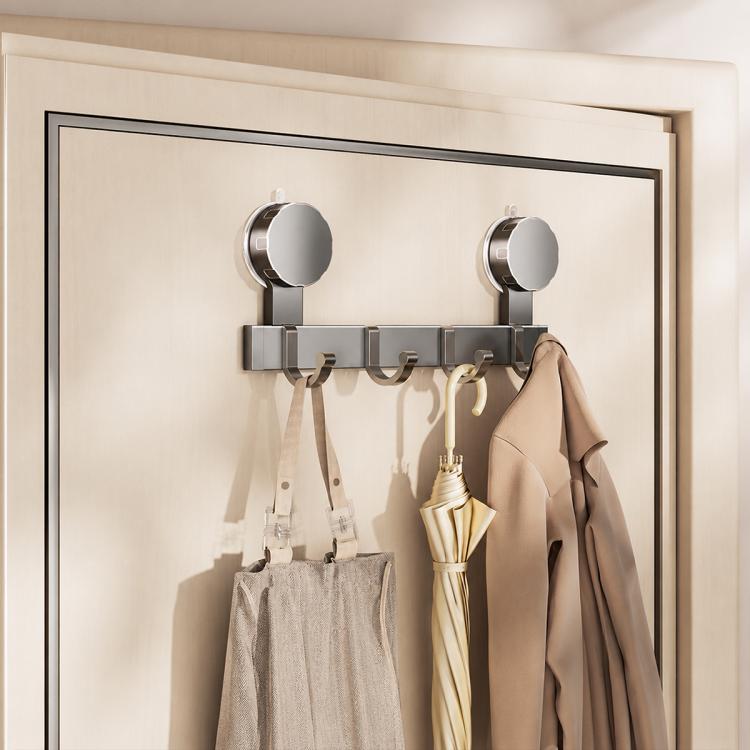 No-drill vacuum suction cup hook rack with chrome hooks and beige coats with umbrella