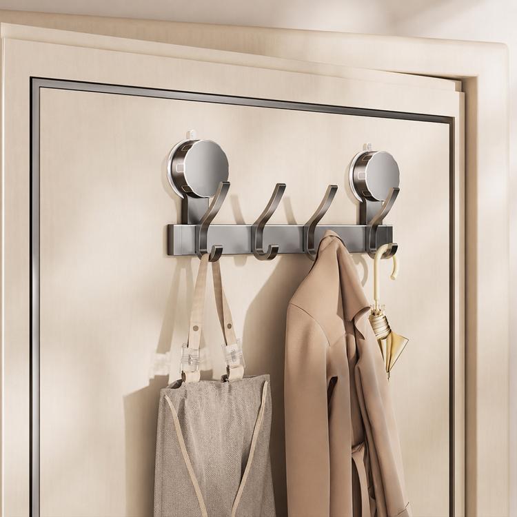No-drill vacuum suction cup hook rack with chrome hooks holding coats and umbrella