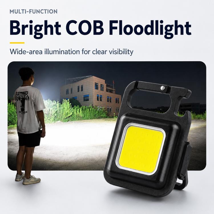 Black COB floodlight-style keychain light with yellow panel and side handle