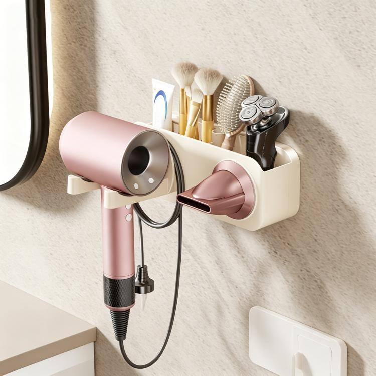 Suction-cup hair dryer wall rack holding pink dryer and grooming tools on a shelf