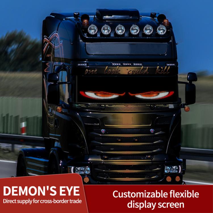 Black truck with glowing LED eye display on the front grille area