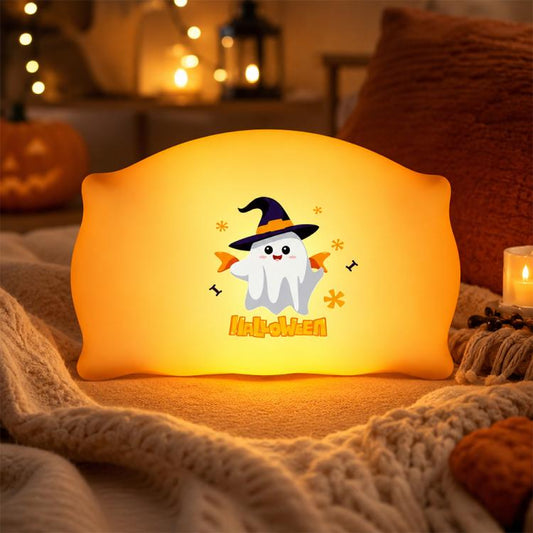 Glowing ghost witch pillow night light with star accents