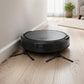 Robot vacuum on floor with two visible side brushes near dust
