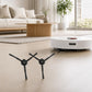 Robot vacuum with black side brush arms extended for sweeping corners