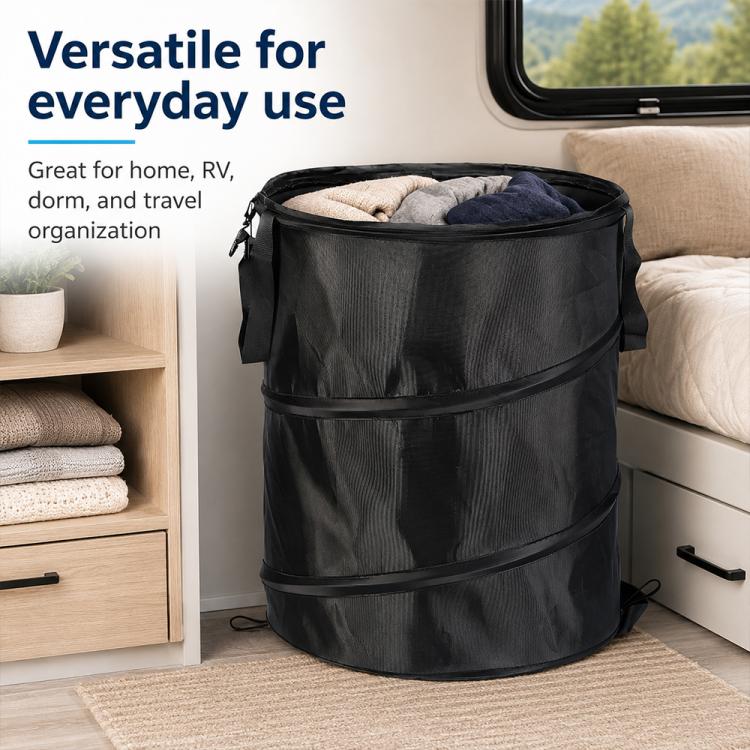 Black folding organizer bucket with side carry handles holding folded linens