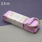 Two-tone yoga stretch strap with silver D-ring buckle, rolled in purple tones.
