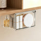 Clear pull-out storage drawer with metal side rails, holding bottles and paper rolls