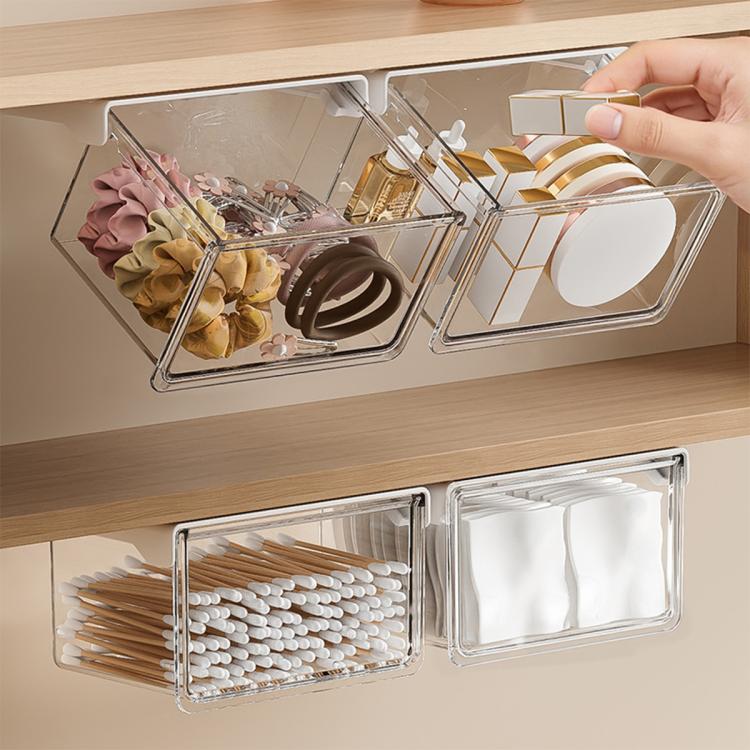 Pull-out transparent organizer tray with metal frame, holding toiletry items