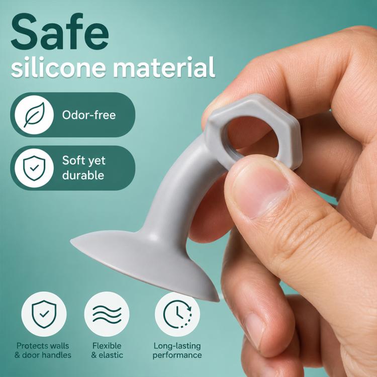Grey silicone suction bumper pad held by hand, with protective ring for door handles
