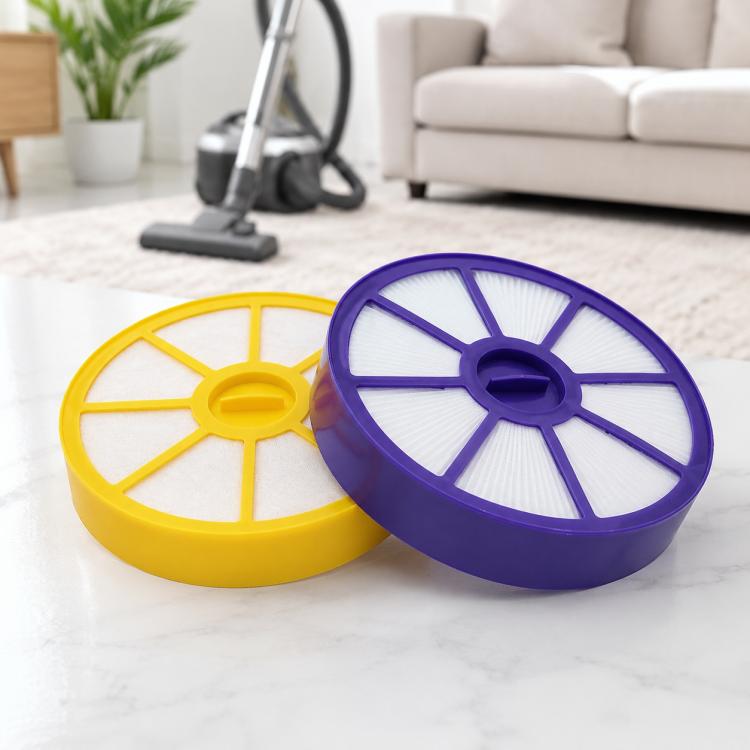 Two vacuum filters shown: yellow pre-filter and purple air outlet filter