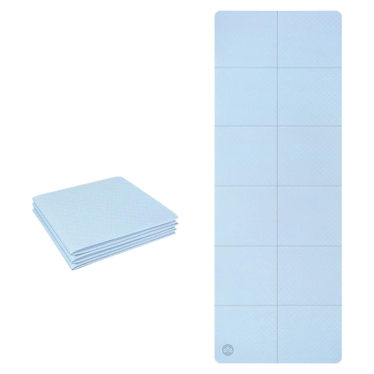 Foldable non-slip yoga mat, light blue, 4mm thick with grid panels.