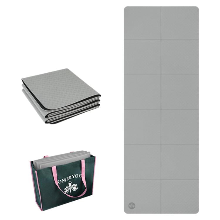 Foldable non-slip yoga mat, gray, 4mm thick with grid panels.