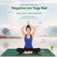 Negative ion yoga mat in dark green, laid flat for seated stretching practice.
