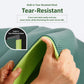 Teal training mat edge with visible tear-resistant mesh and lime underside layer.