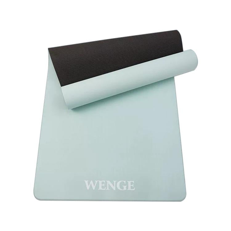 Light mint and black non-slip yoga mat rolled up with textured grip surface
