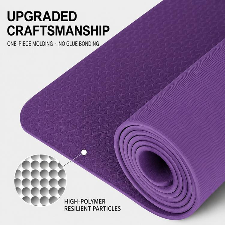 Purple non-slip yoga mat with pebble-textured surface and rolled edge detail