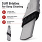 Close-up of gray vacuum brush head with stiff black bristles along the front edge.