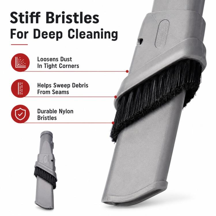 Close-up of gray vacuum brush head with stiff black bristles along the front edge.