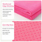 Pink yoga towel with reinforced stitched edge and textured anti-slip dot pattern.