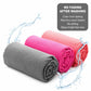 Folded gray and pink yoga towels with textured woven non-slip grip.