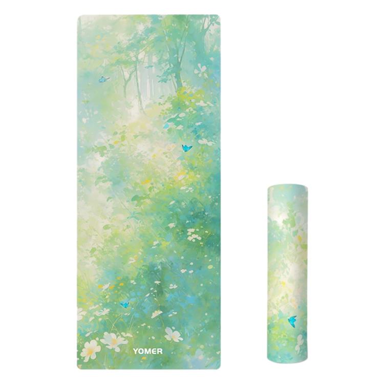 Printed yoga mat with light green forest and butterflies pattern, non-slip surface.