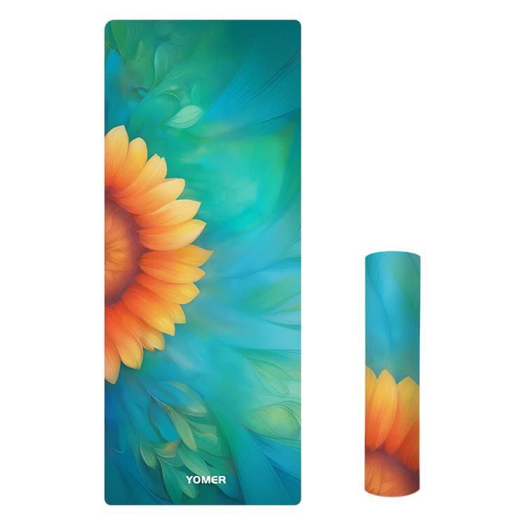 Printed yoga mat with large orange flower and teal green leaves, non-slip grip.