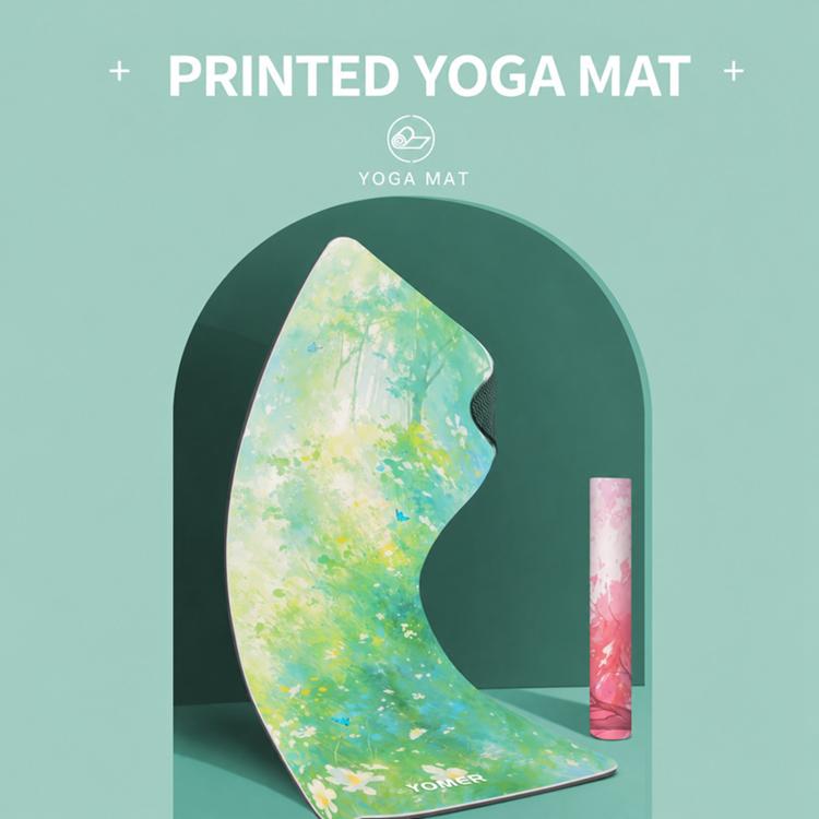 Yoga mat with light green floral tree-print design, visible thickness and edges.