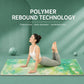 Yoga mat with light green floral forest print, used during a seated yoga stretch.