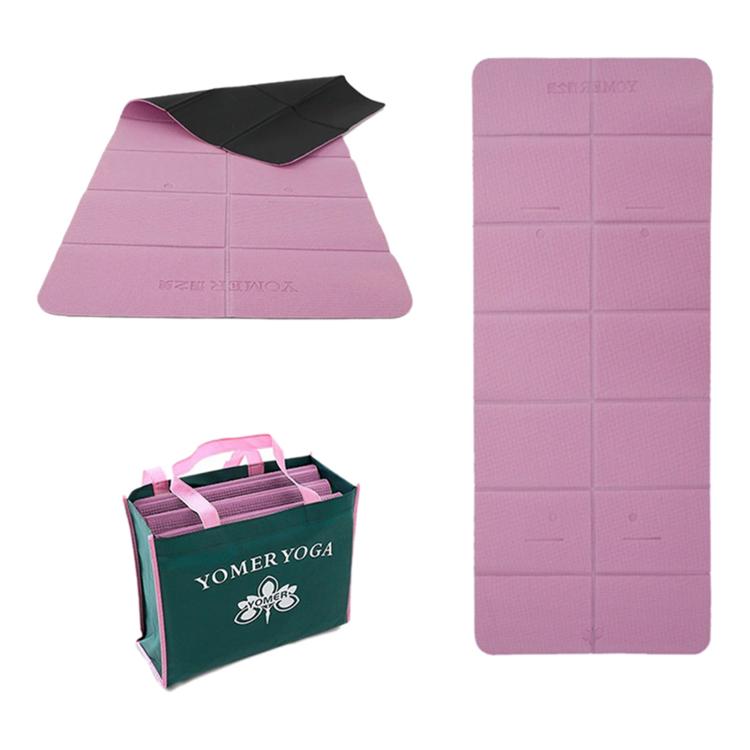 Foldable travel yoga mat in mauve with dark fold-over cover