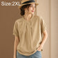 Tan women’s short-sleeve shirt with stand collar and centered button placket