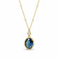 Gold-tone oval pendant necklace with blue teardrop crystal and round clear top