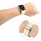 White stretchy nylon Apple Watch band worn on wrist with black clasp