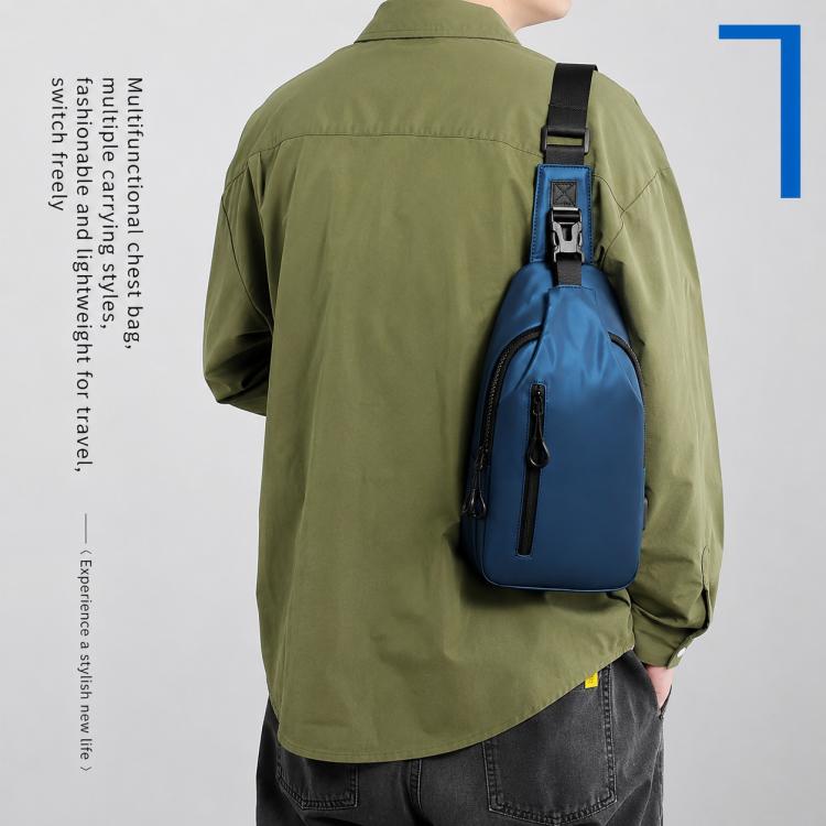 Blue waterproof crossbody sling bag with adjustable strap and front zip pocket