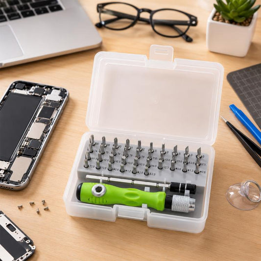 Magnetic screwdriver bit set in clear plastic case with green handle and precision bits