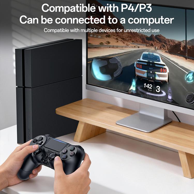 Black wireless game controller in hand with dual thumbsticks and directional pad.